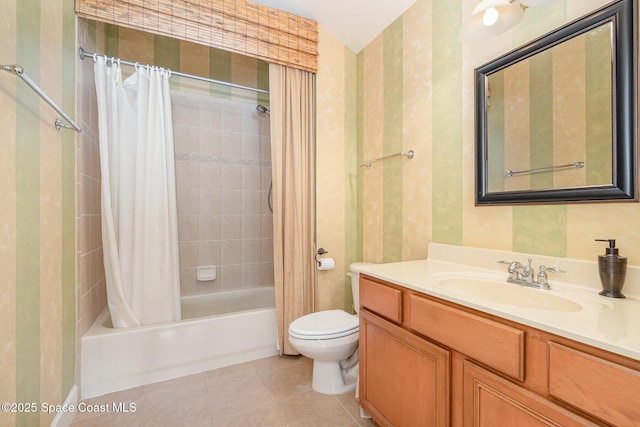 1472 Bent Palm Dr, Merritt Island, FL 32952 - bathroom with shower / tub combo, tile patterned floors, wallpapered walls, toilet, and vanity