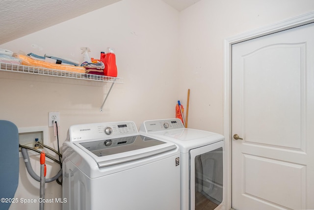 1472 Bent Palm Dr, Merritt Island, FL 32952 - laundry room with separate washer and dryer and a textured ceiling