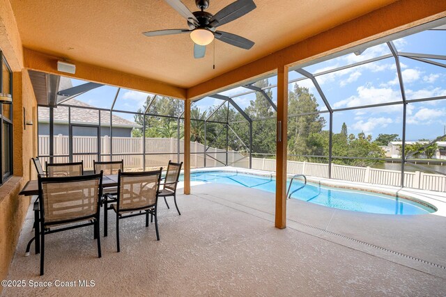 1472 Bent Palm Dr, Merritt Island, FL 32952 - view of swimming pool featuring a patio area, a ceiling fan, a lanai, and a fenced backyard