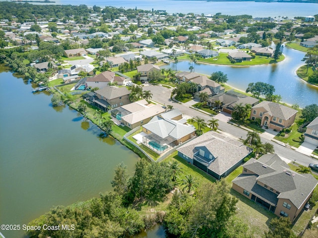 1472 Bent Palm Dr, Merritt Island, FL 32952 - aerial perspective of suburban area with a nearby body of water