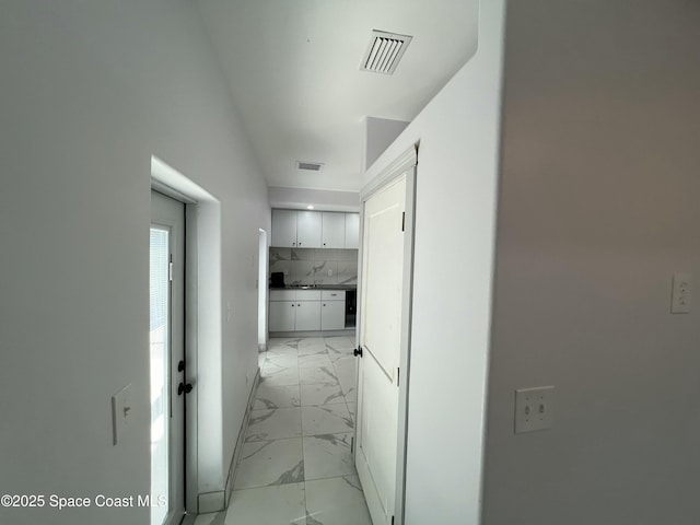 1279 Earl Dr, Merritt Island, FL 32952 - corridor with visible vents and marble finish floor