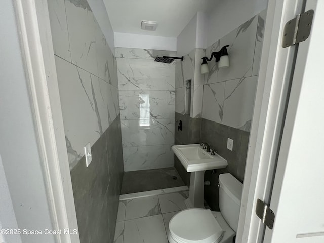 1279 Earl Dr, Merritt Island, FL 32952 - full bath with toilet, tile walls, marble finish floor, and a marble finish shower