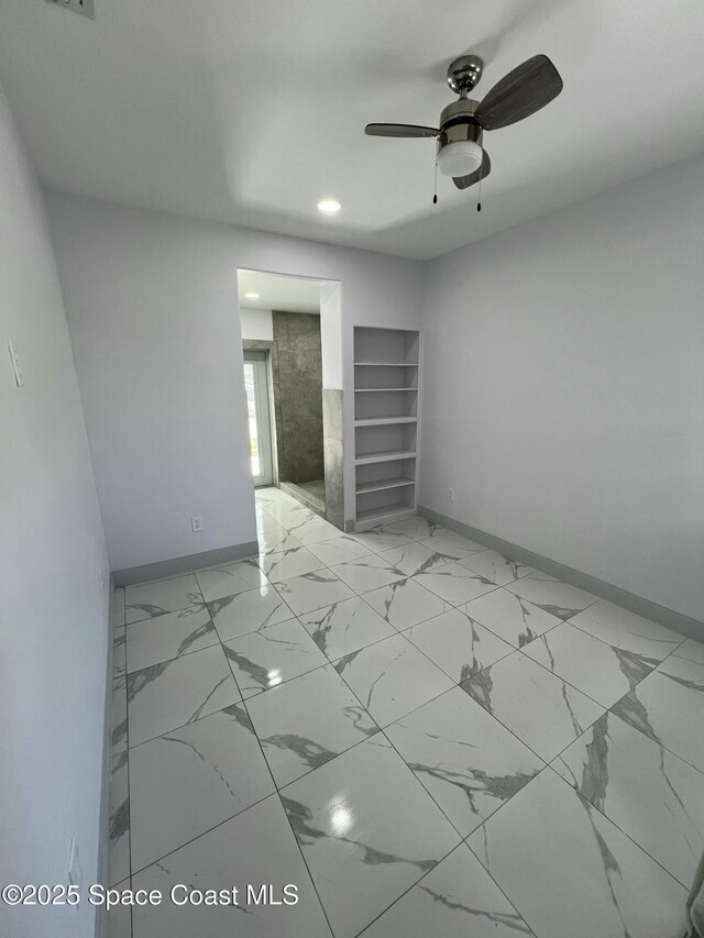 1279 Earl Dr, Merritt Island, FL 32952 - unfurnished bedroom with recessed lighting, marble finish floor, baseboards, and ceiling fan