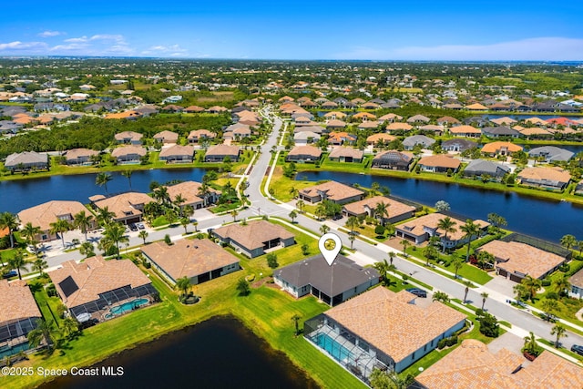 aerial view featuring a residential view and a water view