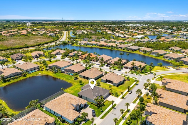 aerial view featuring a water view and a residential view