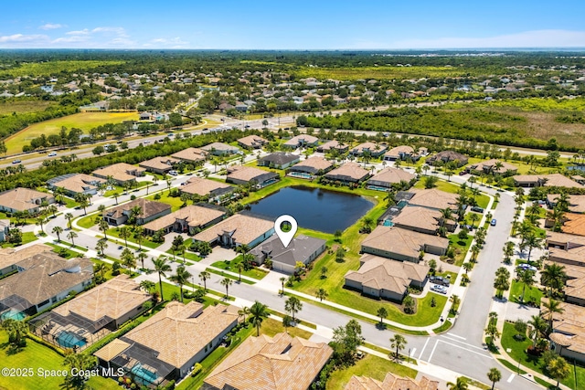 aerial view with a water view and a residential view