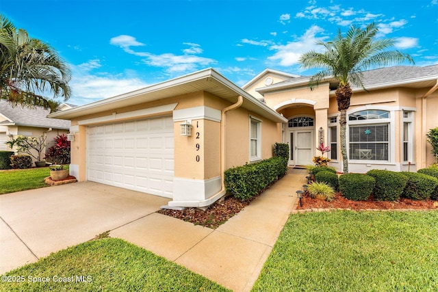 view of front of property with a garage, a front lawn, stucco siding, and concrete driveway