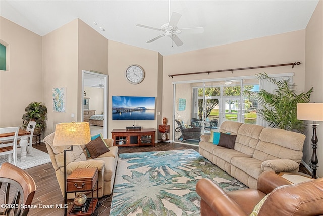 living room with ceiling fan, high vaulted ceiling, and wood finished floors