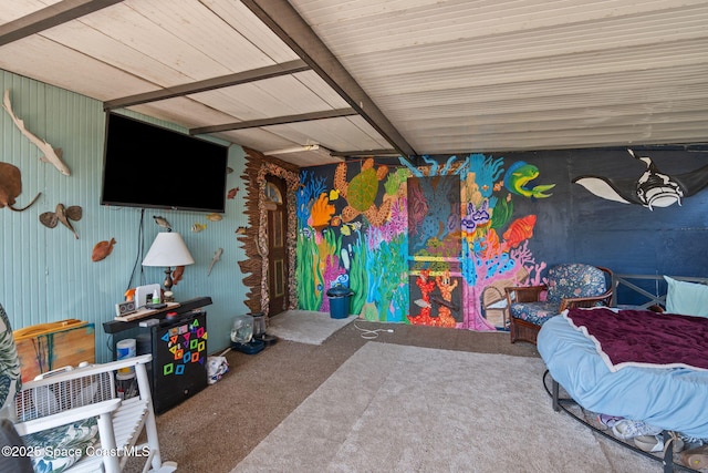 bedroom featuring carpet floors and beamed ceiling