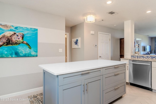 kitchen featuring visible vents, recessed lighting, dishwasher, gray cabinets, and light countertops