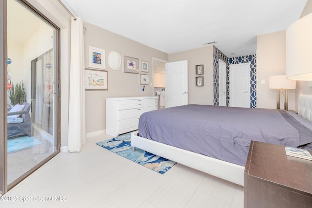 bedroom featuring visible vents and baseboards
