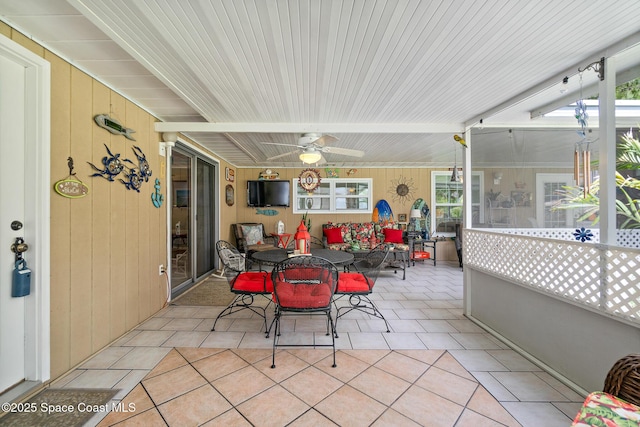 view of patio / terrace with a ceiling fan and outdoor dining space