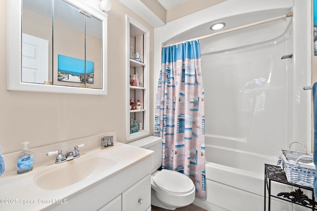 bathroom with vanity, toilet, and shower / tub combo