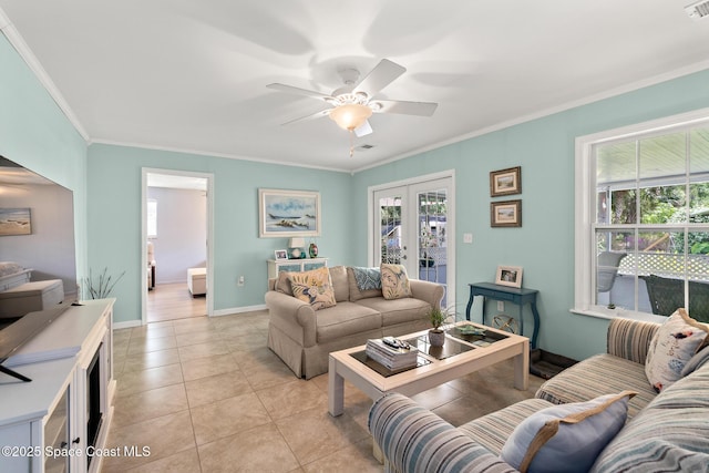 living room featuring crown molding, light tile patterned floors, ceiling fan, and french doors