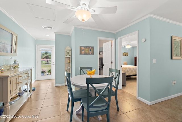 dining space with visible vents, a ceiling fan, baseboards, and light tile patterned floors