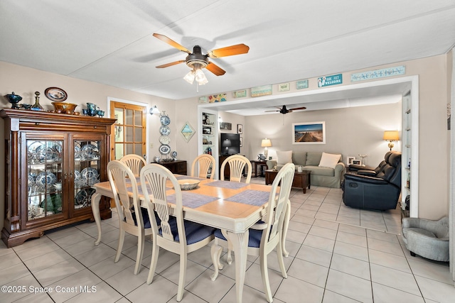 dining room with a ceiling fan and light tile patterned floors