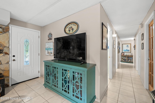 foyer entrance with light tile patterned flooring