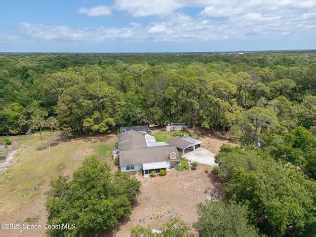 aerial view featuring a view of trees