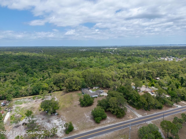 aerial view featuring a view of trees
