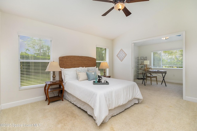 3196 Quint Dr, Melbourne, FL 32940 - bedroom featuring baseboards, light colored carpet, vaulted ceiling, and a ceiling fan