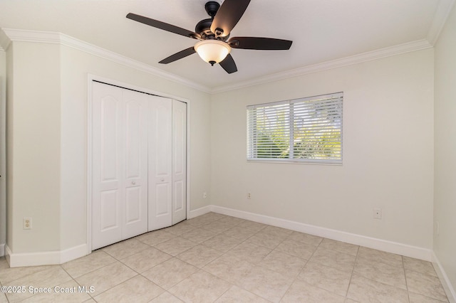 3196 Quint Dr, Melbourne, FL 32940 - unfurnished bedroom featuring crown molding, a closet, light tile patterned floors, baseboards, and a ceiling fan
