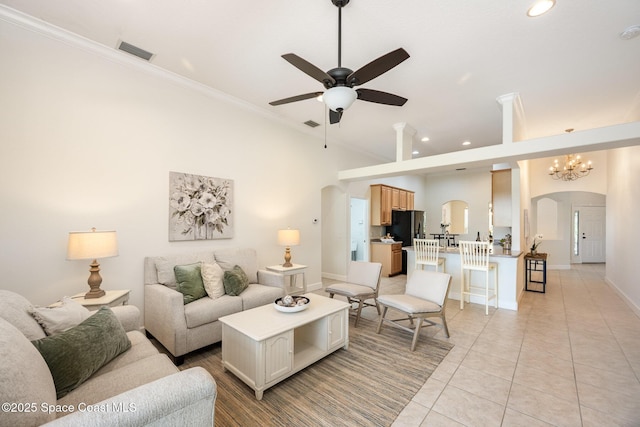 3196 Quint Dr, Melbourne, FL 32940 - living room featuring arched walkways, a ceiling fan, recessed lighting, ornamental molding, and light tile patterned floors