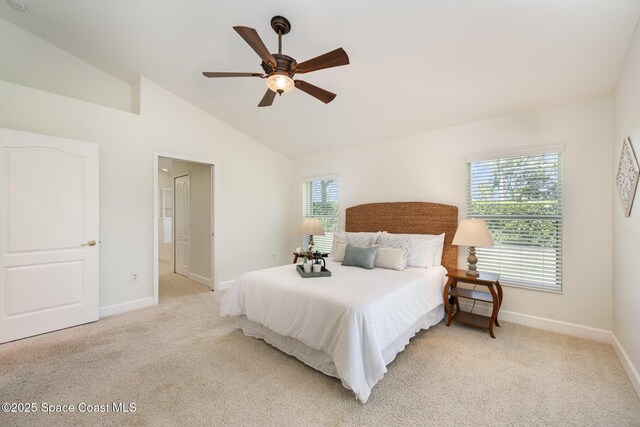 3196 Quint Dr, Melbourne, FL 32940 - bedroom with baseboards, light colored carpet, vaulted ceiling, and ceiling fan