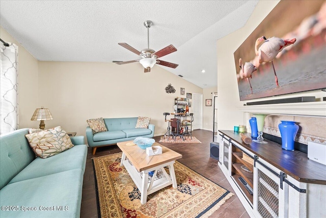 6280 Golfview Ave, Cocoa, FL 32927 - living room with a ceiling fan, a textured ceiling, and lofted ceiling