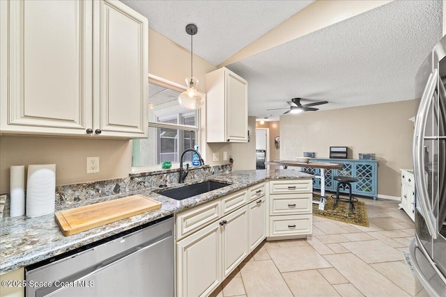 6280 Golfview Ave, Cocoa, FL 32927 - kitchen with light stone countertops, ceiling fan, a textured ceiling, a sink, and appliances with stainless steel finishes