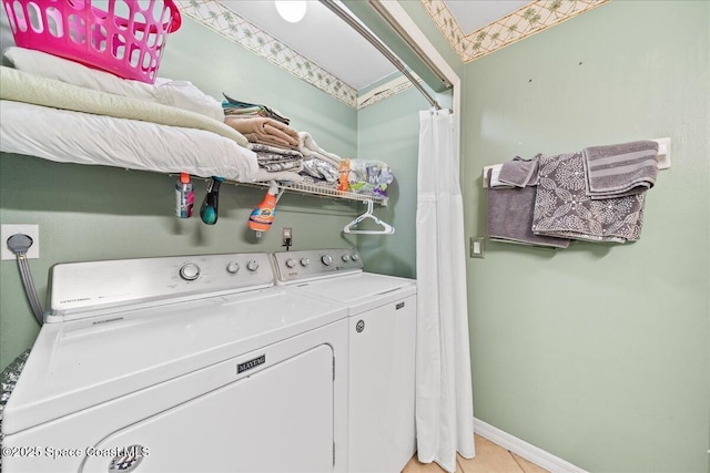 6280 Golfview Ave, Cocoa, FL 32927 - laundry area with independent washer and dryer, baseboards, light tile patterned floors, and laundry area