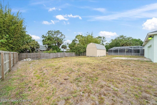 6280 Golfview Ave, Cocoa, FL 32927 - view of yard featuring a fenced backyard, an outdoor structure, and a storage shed
