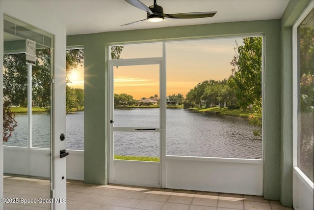 3871 La Flor Dr, Rockledge, FL 32955 - unfurnished sunroom with a ceiling fan, tile patterned floors, and a water view
