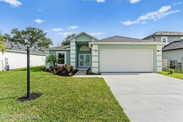 3871 La Flor Dr, Rockledge, FL 32955 - ranch-style home featuring stucco siding, an attached garage, driveway, french doors, and a front yard
