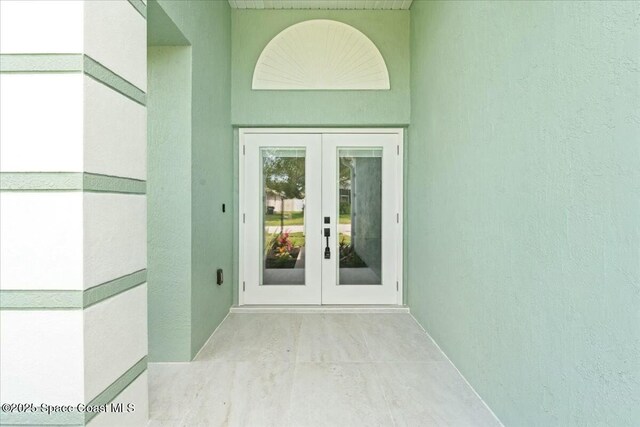 3871 La Flor Dr, Rockledge, FL 32955 - doorway to property with stucco siding and french doors