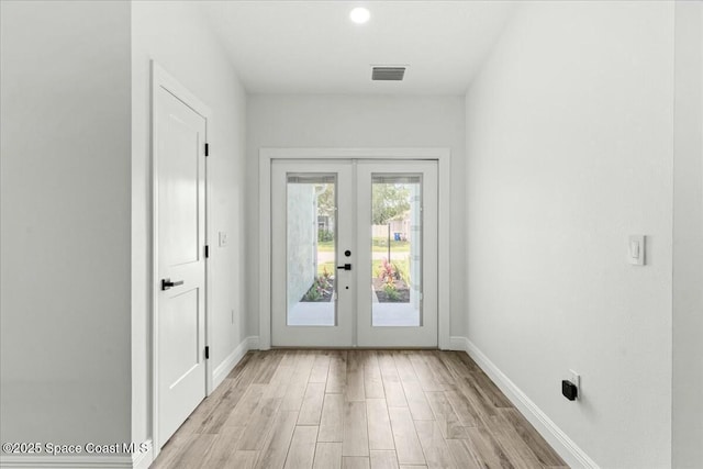 3871 La Flor Dr, Rockledge, FL 32955 - doorway to outside with baseboards, french doors, light wood-style floors, and visible vents