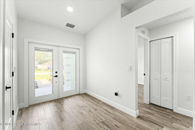3871 La Flor Dr, Rockledge, FL 32955 - doorway to outside with wood finished floors, visible vents, baseboards, and french doors