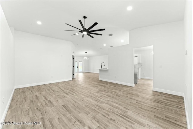 3871 La Flor Dr, Rockledge, FL 32955 - unfurnished living room with recessed lighting, vaulted ceiling, light wood-type flooring, and ceiling fan