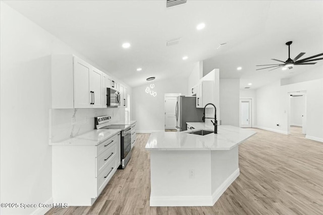 3871 La Flor Dr, Rockledge, FL 32955 - kitchen featuring stainless steel appliances, vaulted ceiling, a sink, baseboards, and ceiling fan