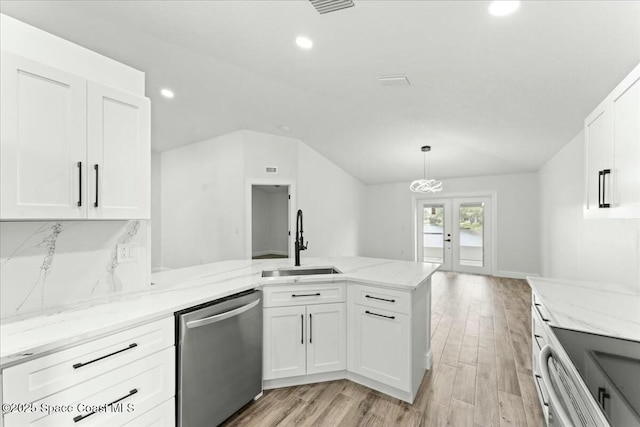 3871 La Flor Dr, Rockledge, FL 32955 - kitchen featuring white cabinets, recessed lighting, stainless steel dishwasher, a sink, and a peninsula