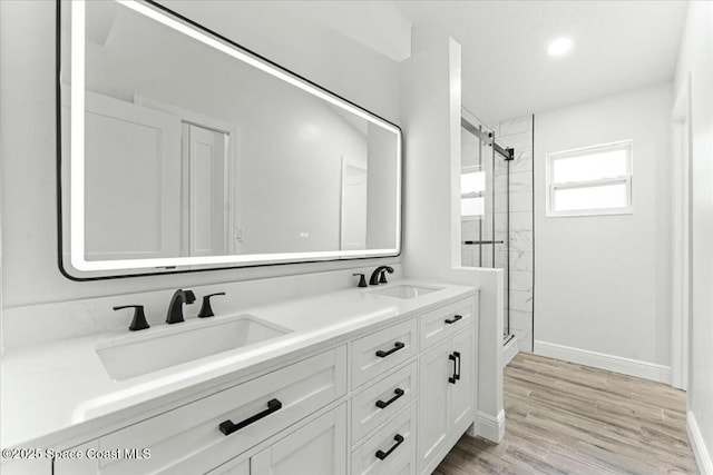 3871 La Flor Dr, Rockledge, FL 32955 - bathroom with a shower stall, baseboards, and a sink