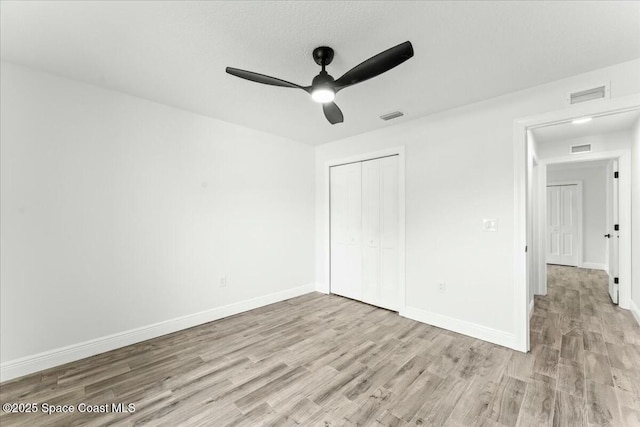 3871 La Flor Dr, Rockledge, FL 32955 - unfurnished bedroom featuring a closet, light wood-type flooring, visible vents, and baseboards