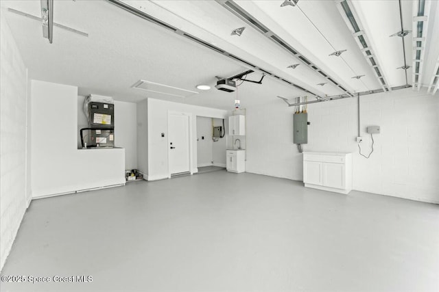 3871 La Flor Dr, Rockledge, FL 32955 - garage with electric panel and a garage door opener