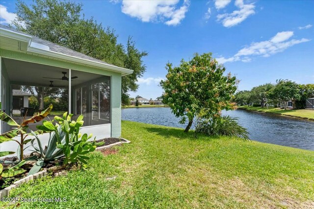 3871 La Flor Dr, Rockledge, FL 32955 - view of yard featuring a sunroom, a water view, and a ceiling fan