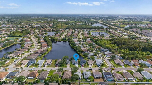 3871 La Flor Dr, Rockledge, FL 32955 - drone / aerial view featuring a residential view and a water view