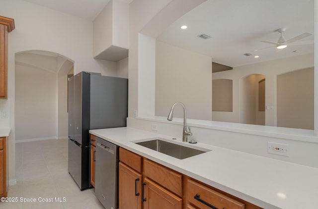 5334 Creekwood Dr, Melbourne, FL 32940 - kitchen with light countertops, visible vents, stainless steel appliances, arched walkways, and a sink