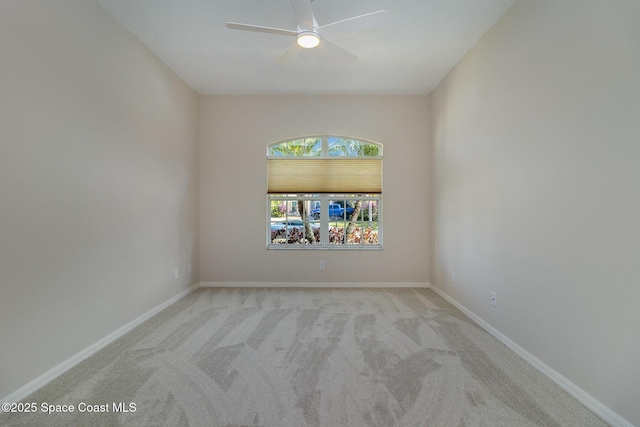 5334 Creekwood Dr, Melbourne, FL 32940 - empty room featuring carpet flooring, baseboards, and a ceiling fan