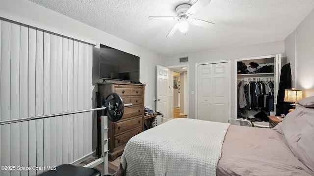 3050 Sir Hamilton Cir Unit 2, Titusville, FL 32780 - bedroom featuring a textured ceiling and a ceiling fan