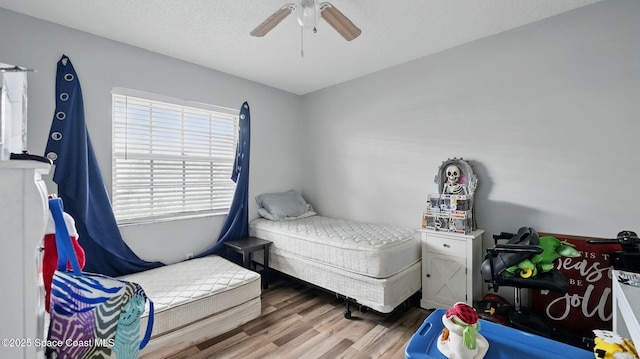 3050 Sir Hamilton Cir Unit 2, Titusville, FL 32780 - bedroom featuring wood finished floors and ceiling fan