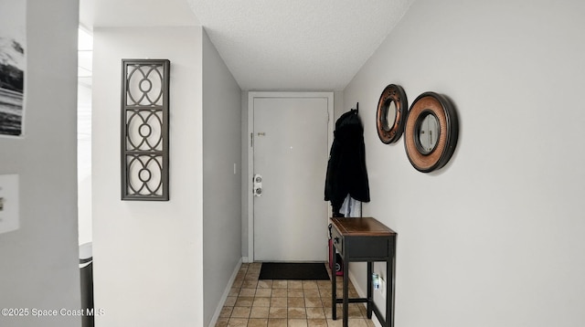 3050 Sir Hamilton Cir Unit 2, Titusville, FL 32780 - doorway to outside featuring baseboards and a textured ceiling