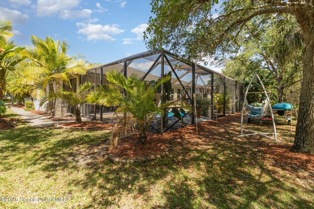 439 Gardendale Cir SE, Palm Bay, FL 32909 - view of yard featuring a lanai